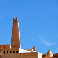 A minaret in Ghardaia set against an azure sky