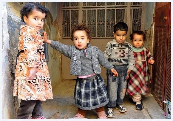 Kiddies in Algeria saying hello to their American visitors!