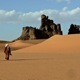 Man wlaking across the Sahara